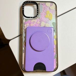 iPhone 11 case with wallet and pop socket attachment, which can be removed.